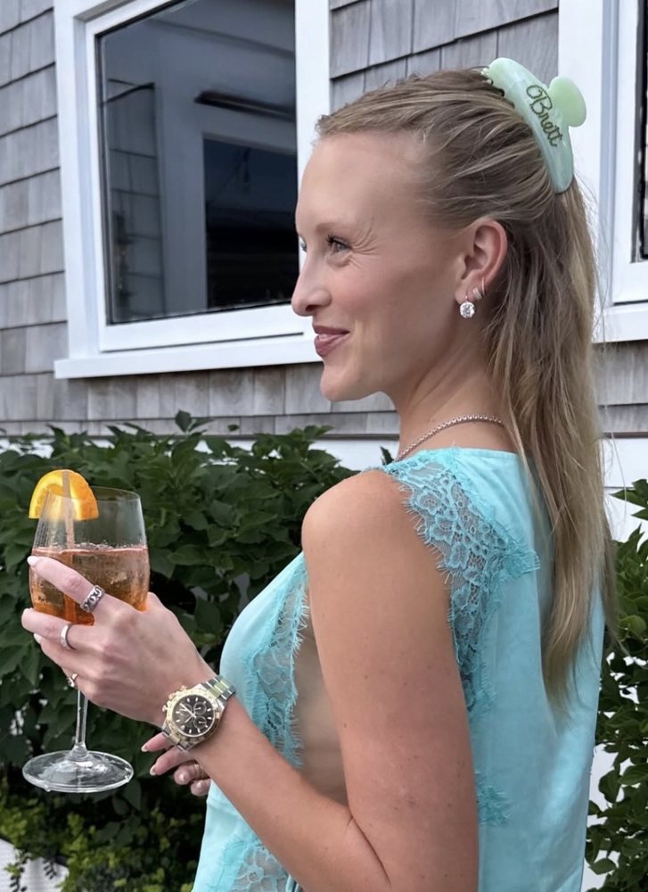 green name clip in a half-up ponytail